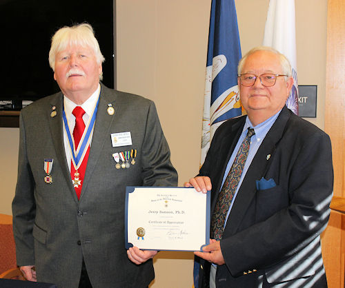 President Gervais Compton presented Dr. Sanson (right) with a Certificate of Appreciation and an LASSAR mug for his presentation.